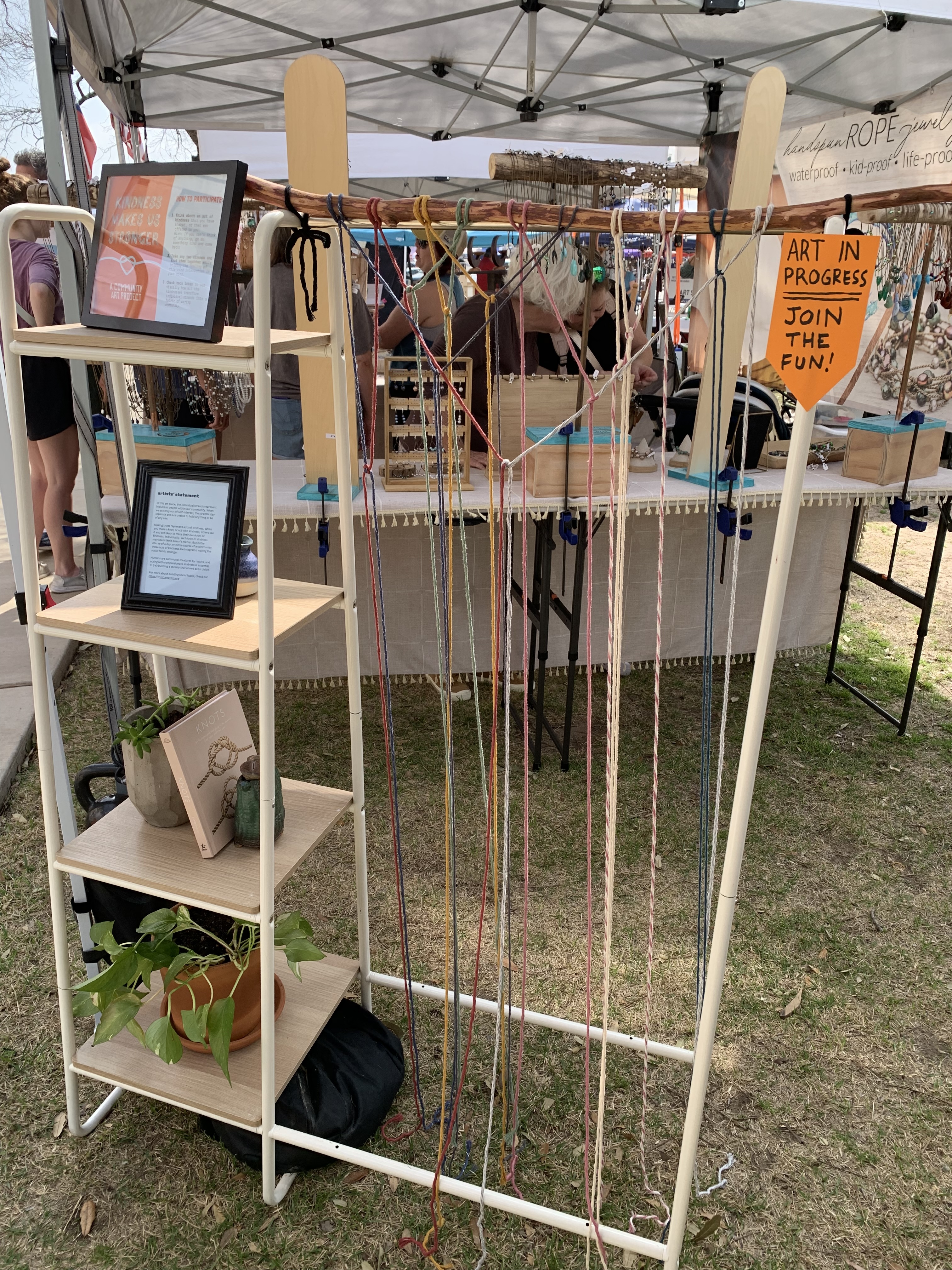 the community art piece on its display, with some knots made