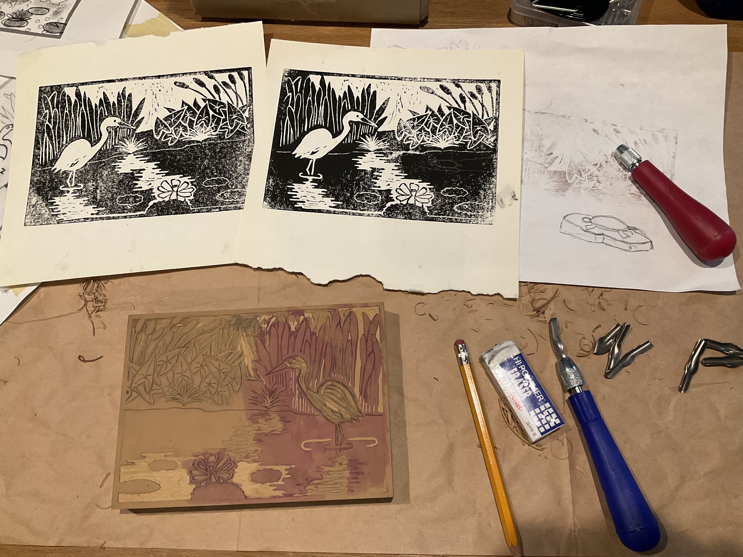 test prints alongside sketch of turtle and partially carved linoleum